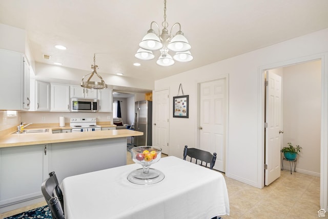 6160 S 1350 E, South Ogden, UT 84405 - dining room with recessed lighting, an inviting chandelier, baseboards, visible vents, and light tile patterned flooring