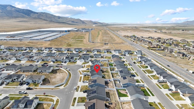 drone / aerial view featuring a mountain view and a residential view