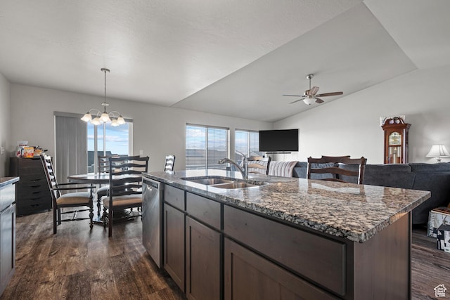 kitchen featuring a sink, dark wood finished floors, open floor plan, lofted ceiling, and ceiling fan with notable chandelier