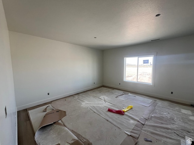 1155 E 1150 S, Garland, UT 84312 - empty room featuring baseboards and a textured ceiling