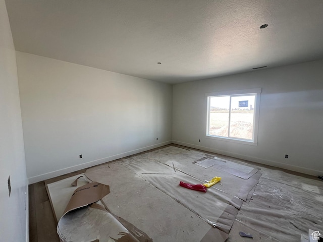 1155 E 1150 S, Garland, UT 84312 - spare room with baseboards and a textured ceiling