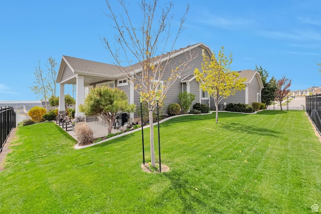 view of property exterior featuring a patio area, a fenced backyard, and a yard