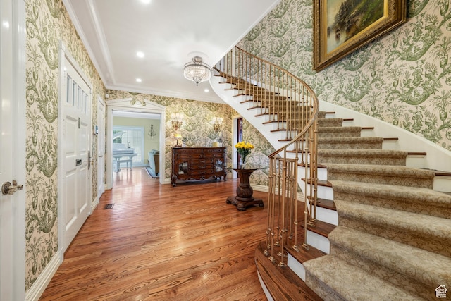 1230 E 11th Ave N, Salt Lake City, UT 84103 - entryway featuring wallpapered walls, crown molding, stairway, light wood-type flooring, and recessed lighting