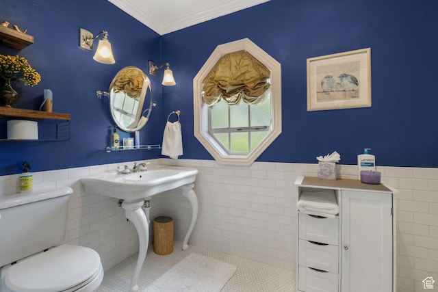 1230 E 11th Ave N, Salt Lake City, UT 84103 - bathroom with tile walls, a wainscoted wall, tile patterned floors, and crown molding