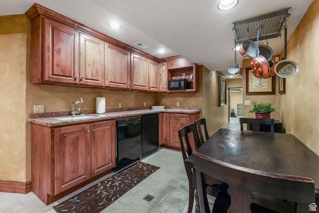 1230 E 11th Ave N, Salt Lake City, UT 84103 - kitchen with baseboards, a sink, brown cabinets, and black appliances