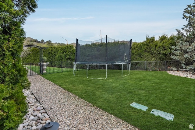 1230 E 11th Ave N, Salt Lake City, UT 84103 - view of yard featuring fence and a trampoline