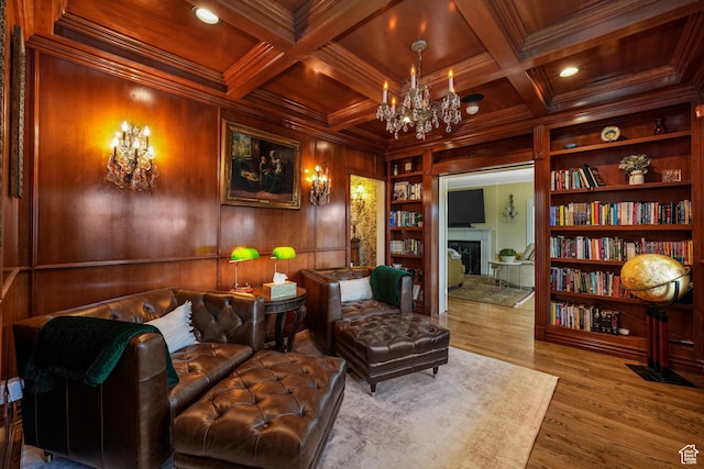 1230 E 11th Ave N, Salt Lake City, UT 84103 - sitting room featuring a fireplace, wooden walls, built in features, a wooden ceiling with exposed beams, and a chandelier