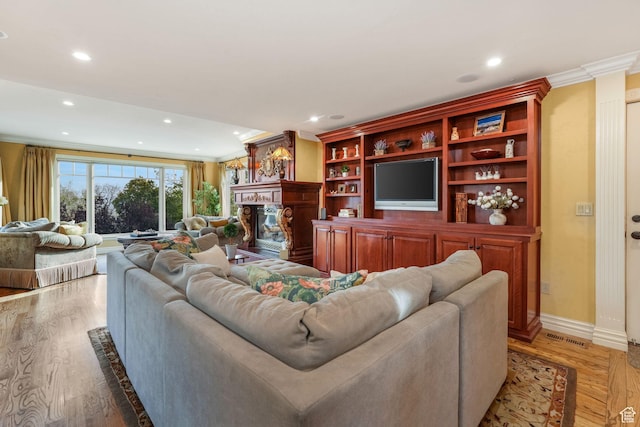 1230 E 11th Ave N, Salt Lake City, UT 84103 - living room featuring a fireplace, visible vents, baseboards, and recessed lighting