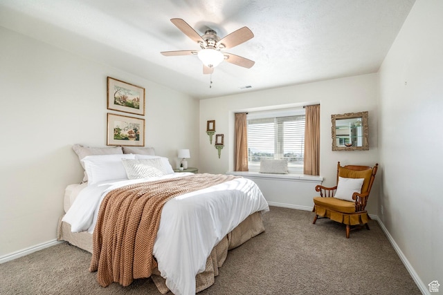 bedroom with carpet floors, visible vents, and baseboards