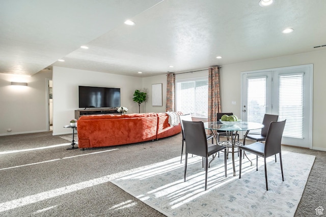 carpeted dining room featuring baseboards and recessed lighting