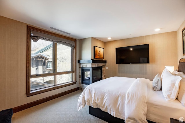 bedroom featuring wallpapered walls, carpet floors, visible vents, and baseboards