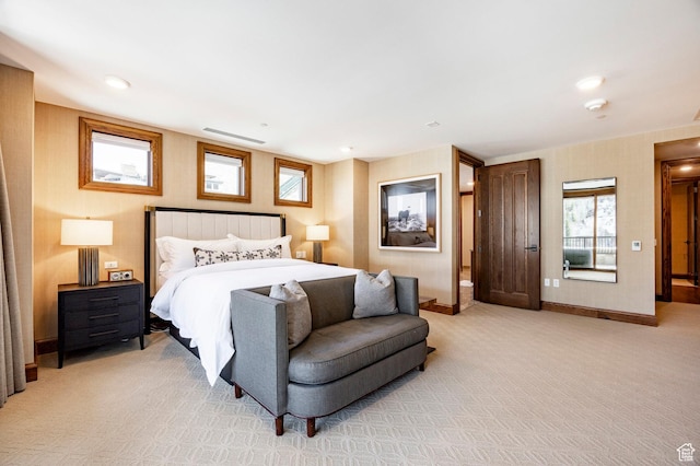 bedroom with recessed lighting, light carpet, and baseboards