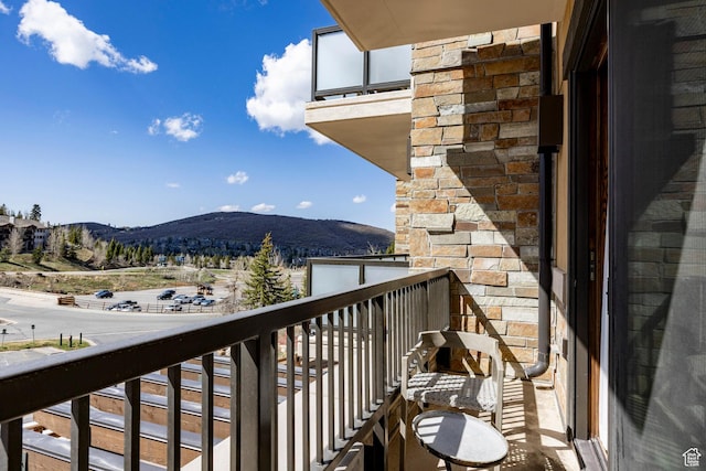 balcony featuring a mountain view