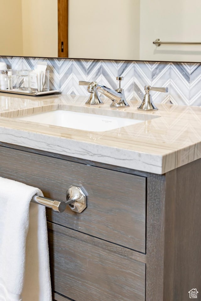 bathroom with vanity and backsplash