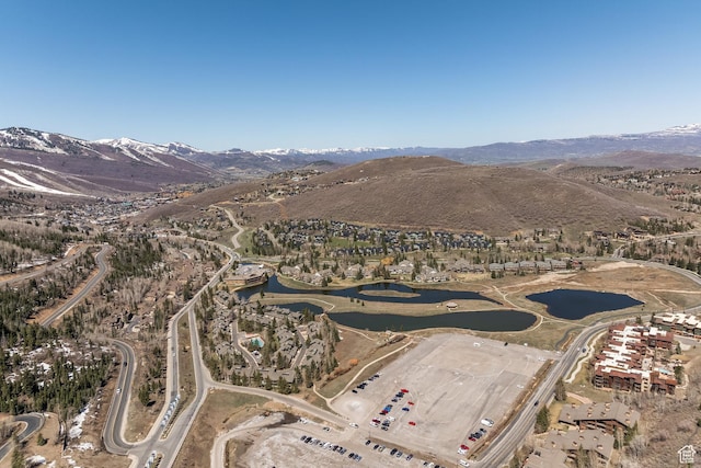 bird's eye view featuring a water and mountain view
