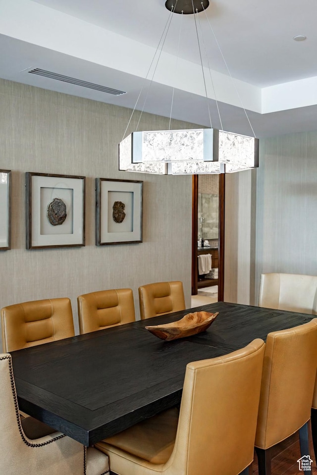 dining area featuring wallpapered walls and visible vents