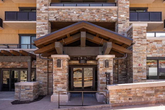 view of exterior entry with stone siding