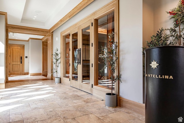 interior space featuring baseboards and stone tile flooring