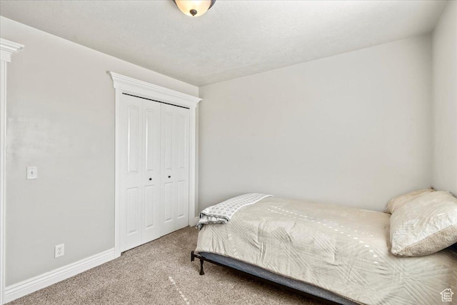 7134 S Rialto Way, West Jordan, UT 84081 - bedroom featuring carpet flooring, a closet, and baseboards