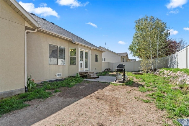 7134 S Rialto Way, West Jordan, UT 84081 - fenced backyard featuring a patio