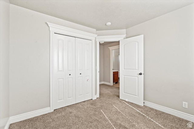 7134 S Rialto Way, West Jordan, UT 84081 - unfurnished bedroom with light colored carpet, a closet, and baseboards