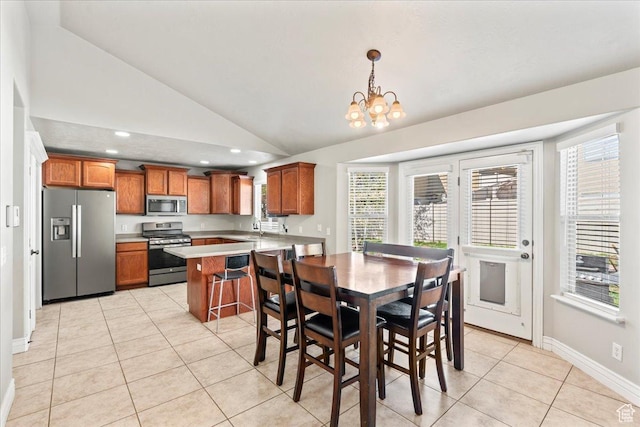 7134 S Rialto Way, West Jordan, UT 84081 - dining area featuring vaulted ceiling, light tile patterned flooring, a chandelier, baseboards, and recessed lighting