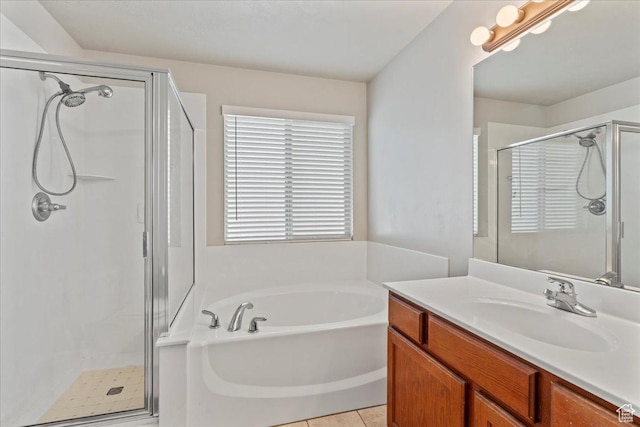 7134 S Rialto Way, West Jordan, UT 84081 - full bathroom with a stall shower, a garden tub, vanity, and tile patterned floors
