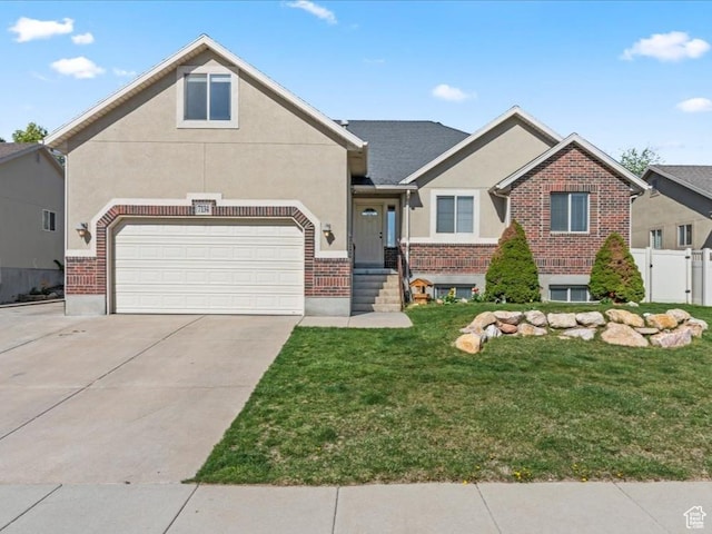 craftsman inspired home with concrete driveway, a front lawn, brick siding, and stucco siding