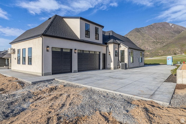 1338 S 1220 E, Salem, UT 84653 - view of front of house with a garage, roof with shingles, a mountain view, and concrete driveway