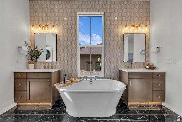 1338 S 1220 E, Salem, UT 84653 - bathroom with a sink, a freestanding tub, marble finish floor, baseboards, and two vanities