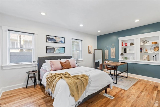 bedroom featuring baseboards, recessed lighting, and light wood-style floors