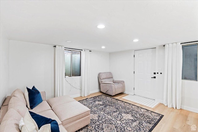 living room with recessed lighting, wood finished floors, and baseboards