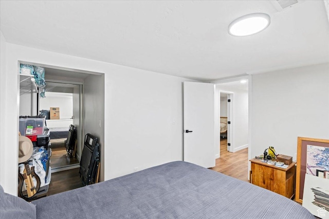 bedroom featuring wood finished floors