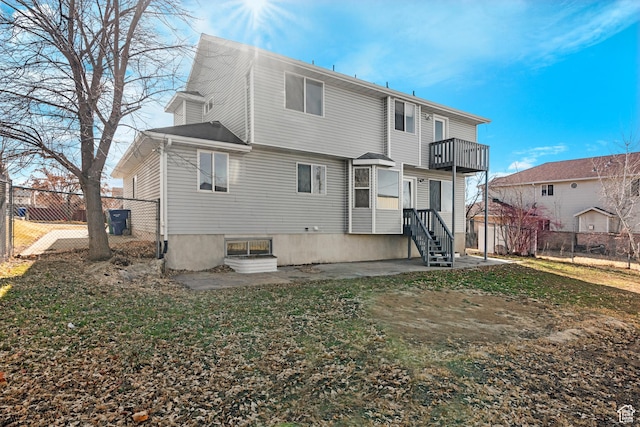 1166 E 4875 S, Ogden, UT 84403 - back of house featuring fence, a balcony, and a yard
