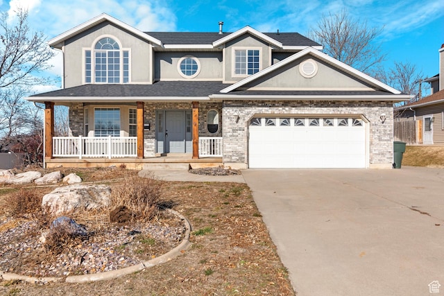 1166 E 4875 S, Ogden, UT 84403 - traditional home featuring stucco siding, covered porch, a garage, and concrete driveway