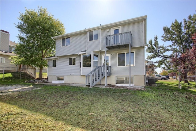 1166 E 4875 S, Ogden, UT 84403 - rear view of property featuring fence, a yard, and a balcony