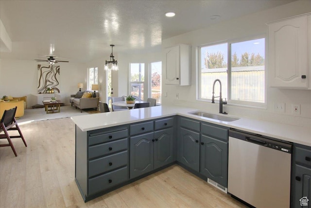 1166 E 4875 S, Ogden, UT 84403 - kitchen with a sink, dishwasher, light wood-style flooring, white cabinets, and a peninsula