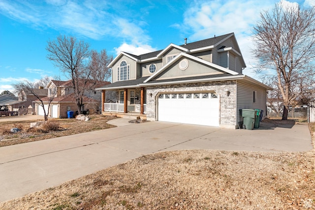 1166 E 4875 S, Ogden, UT 84403 - traditional-style house with a porch, driveway, fence, and a garage