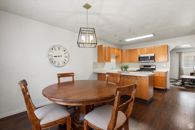 325 E 2300 N, North Ogden, UT 84414 - dining room featuring arched walkways, a notable chandelier, and dark wood-style floors