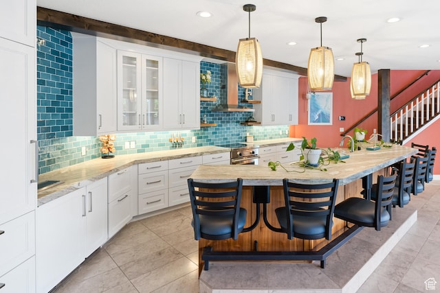 1263 E Chapman Ct, Alpine, UT 84004 - kitchen featuring backsplash, white cabinetry, a kitchen breakfast bar, and recessed lighting