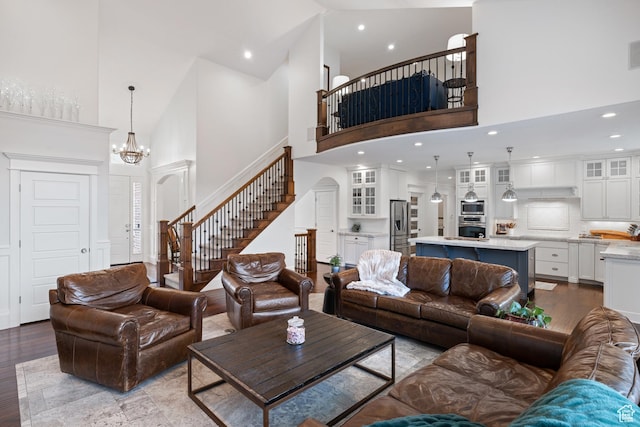 1263 E Chapman Ct, Alpine, UT 84004 - living room with a high ceiling, stairs, wood finished floors, a chandelier, and recessed lighting