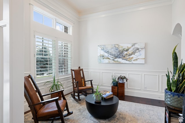 1263 E Chapman Ct, Alpine, UT 84004 - living area featuring healthy amount of natural light, ornamental molding, wood finished floors, a wainscoted wall, and arched walkways