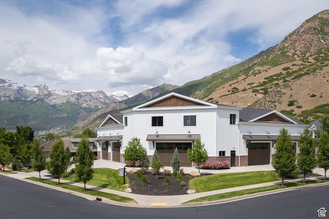1263 E Chapman Ct, Alpine, UT 84004 - modern farmhouse style home featuring a mountain view, a standing seam roof, a garage, metal roof, and board and batten siding