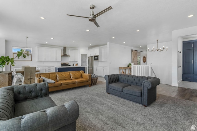 14 E 2300 S, Kaysville, UT 84037 - living room featuring a chandelier, a barn door, ceiling fan, wood finished floors, and recessed lighting