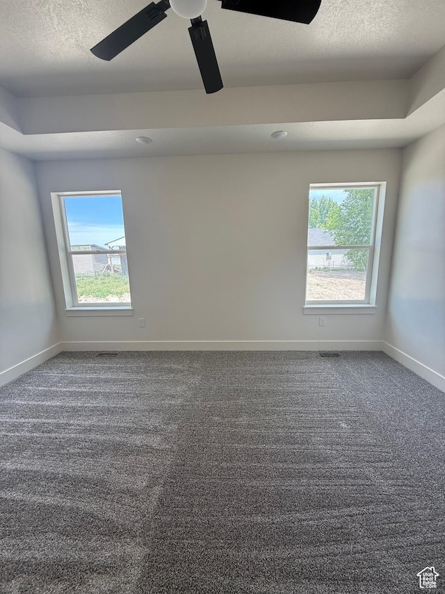 136 W Main St, Fielding, UT 84311 - empty room with carpet flooring, baseboards, a ceiling fan, and a textured ceiling