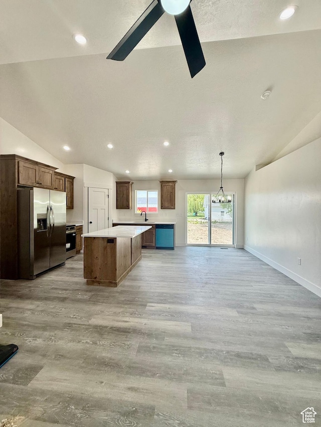 136 W Main St, Fielding, UT 84311 - kitchen featuring stainless steel fridge with ice dispenser, lofted ceiling, a kitchen island, ceiling fan, and light wood-type flooring