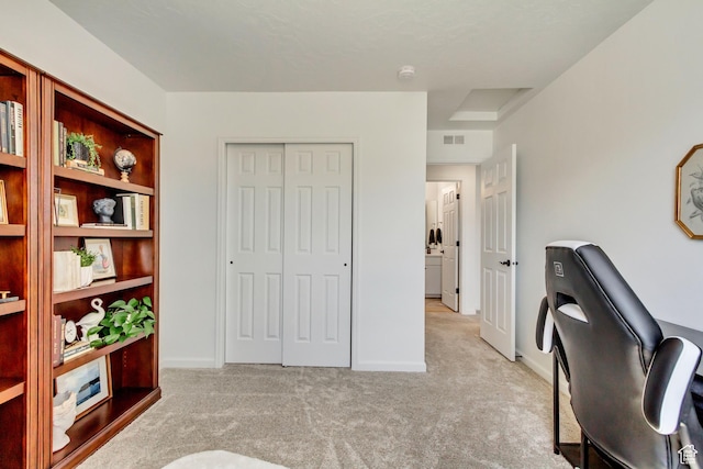 office area featuring carpet floors, visible vents, and baseboards