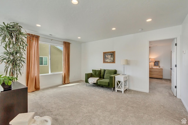 living area featuring recessed lighting, carpet floors, and baseboards