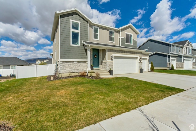 view of front facade featuring fence, board and batten siding, driveway, stone siding, and a garage