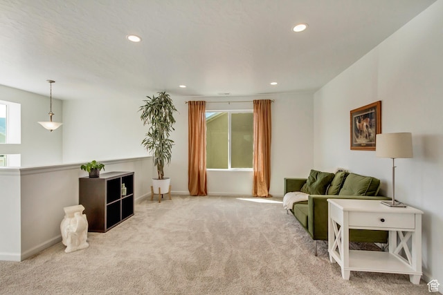 living area featuring baseboards, carpet floors, and recessed lighting